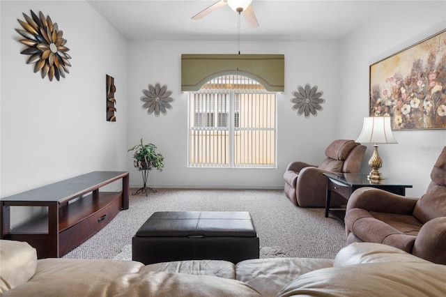 carpeted living room with ceiling fan