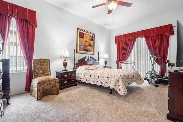 bedroom with ceiling fan and carpet flooring