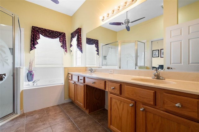 bathroom featuring ceiling fan, independent shower and bath, double vanity, and tile patterned floors