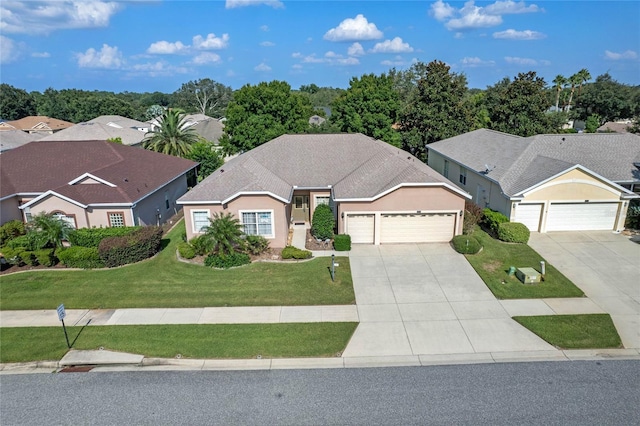 ranch-style home with a garage and a front yard