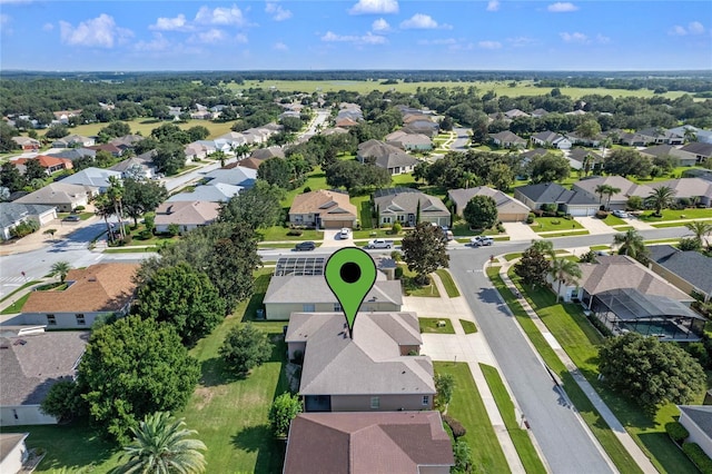 birds eye view of property with a residential view