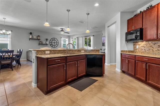 kitchen with ceiling fan with notable chandelier, pendant lighting, light tile patterned floors, sink, and black appliances