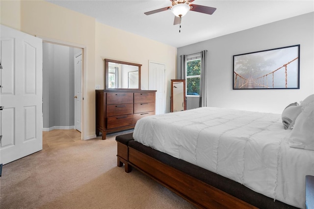 bedroom with ceiling fan, carpet flooring, and baseboards