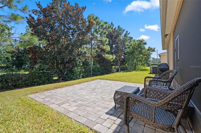 view of patio with central AC