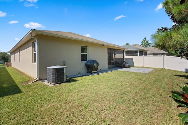 rear view of house featuring central AC, a patio, fence, and stucco siding