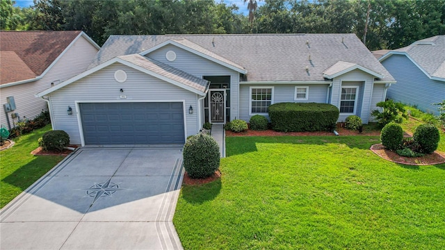 ranch-style house featuring a garage and a front lawn