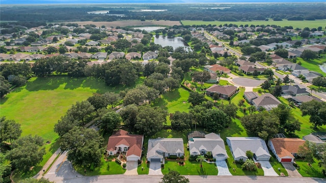 bird's eye view featuring a residential view and a water view