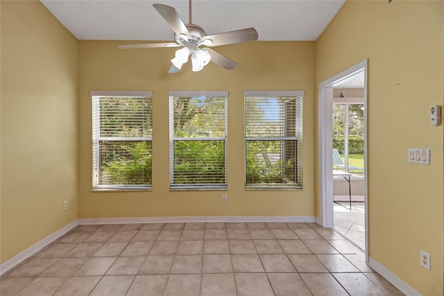 tiled empty room with ceiling fan