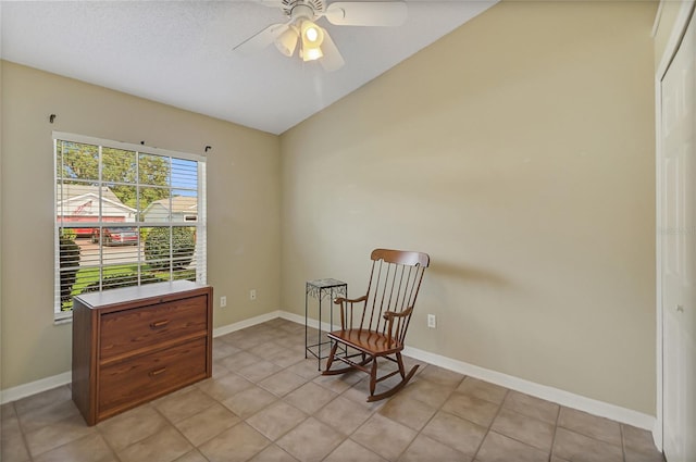 sitting room featuring ceiling fan, lofted ceiling, and light tile patterned floors