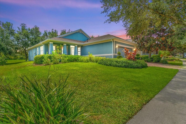 ranch-style house featuring a yard