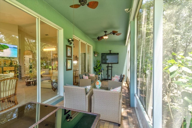 sunroom / solarium with ceiling fan