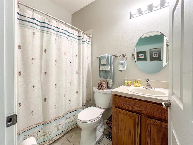 bathroom with toilet, walk in shower, tile patterned floors, and vanity