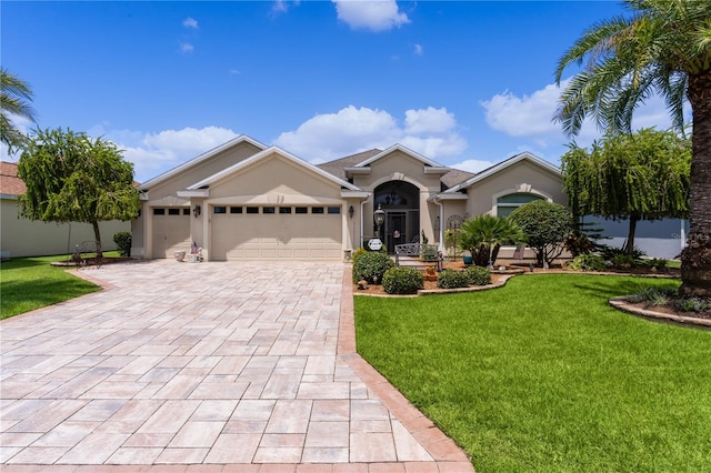 single story home featuring a front yard and a garage