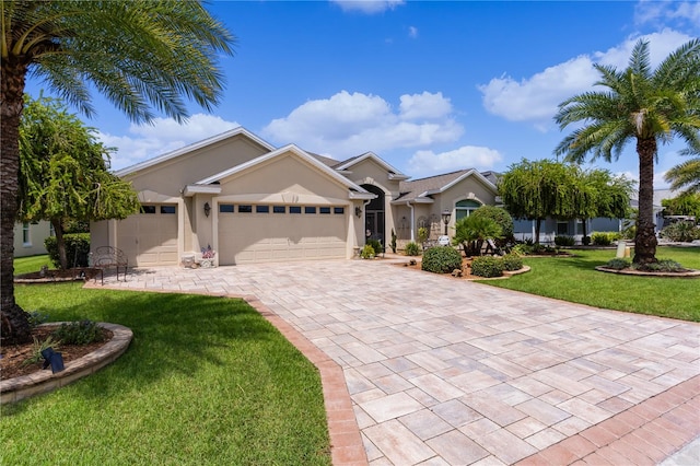 view of front of home with a garage and a front yard