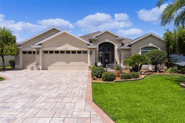 single story home with a front lawn and a garage