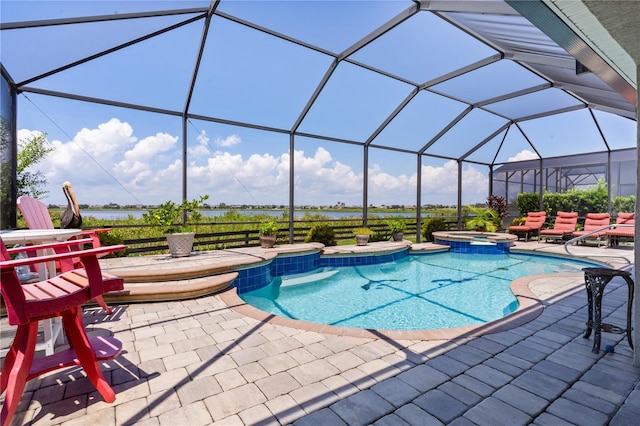 view of swimming pool featuring an in ground hot tub, a patio area, and a lanai