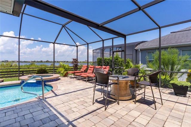 view of patio with glass enclosure and a pool with hot tub