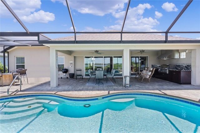 view of pool featuring ceiling fan, area for grilling, a patio area, and a lanai