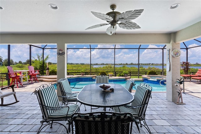 view of patio / terrace with ceiling fan and a lanai