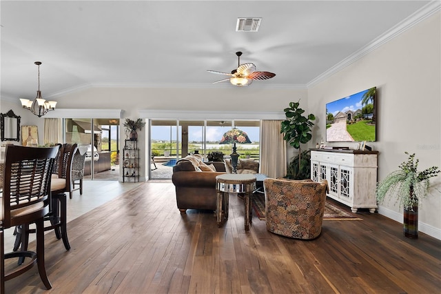 living room featuring ceiling fan with notable chandelier, vaulted ceiling, hardwood / wood-style floors, and ornamental molding