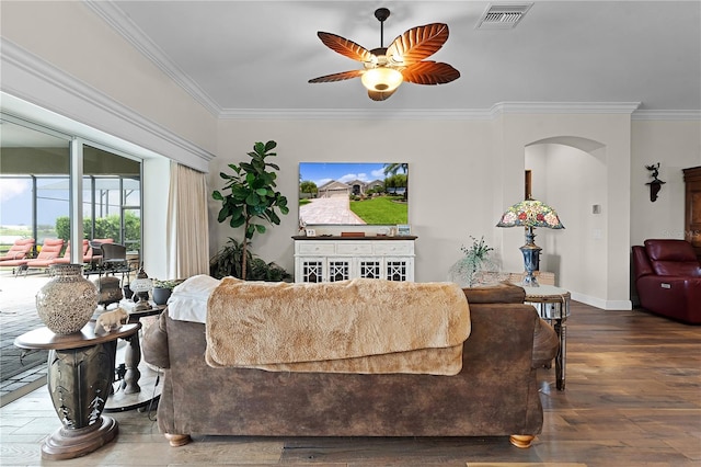 living room with ceiling fan, hardwood / wood-style flooring, and crown molding