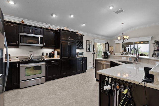 kitchen featuring stainless steel appliances, sink, lofted ceiling, a notable chandelier, and light tile patterned flooring