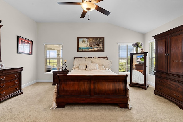 carpeted bedroom featuring ceiling fan and vaulted ceiling