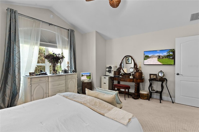 carpeted bedroom featuring ceiling fan and vaulted ceiling