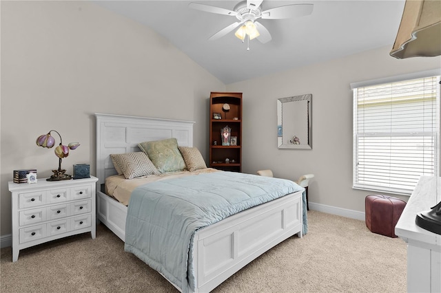 carpeted bedroom featuring ceiling fan and vaulted ceiling