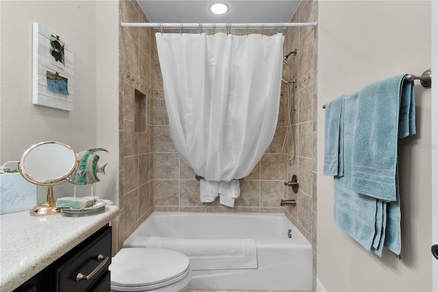 full bathroom featuring vanity, shower / tub combo, and toilet