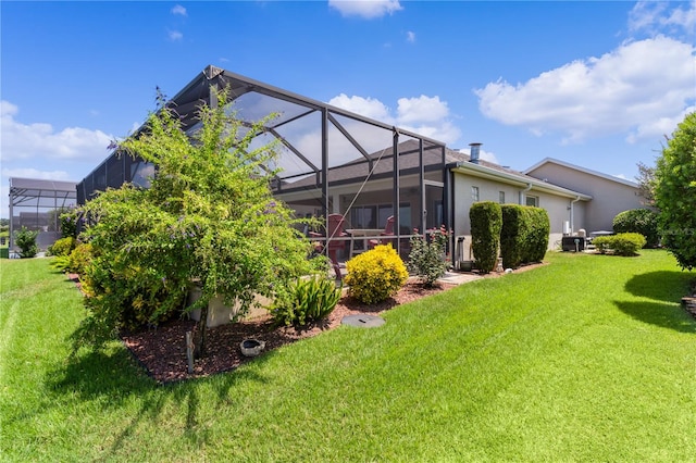 view of yard with glass enclosure