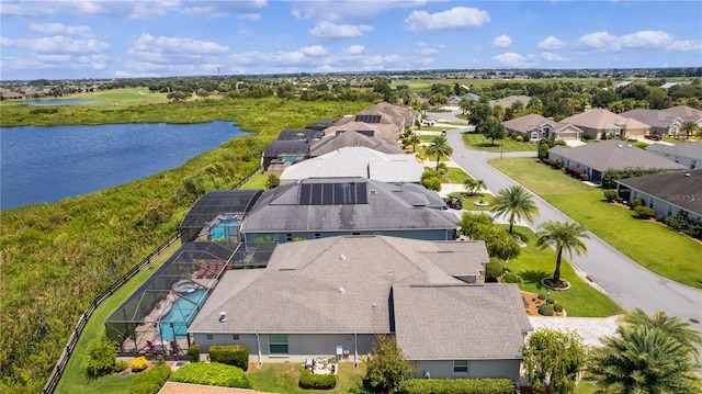 drone / aerial view with a water view