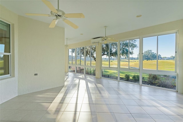 unfurnished sunroom featuring an AC wall unit, a wealth of natural light, and ceiling fan