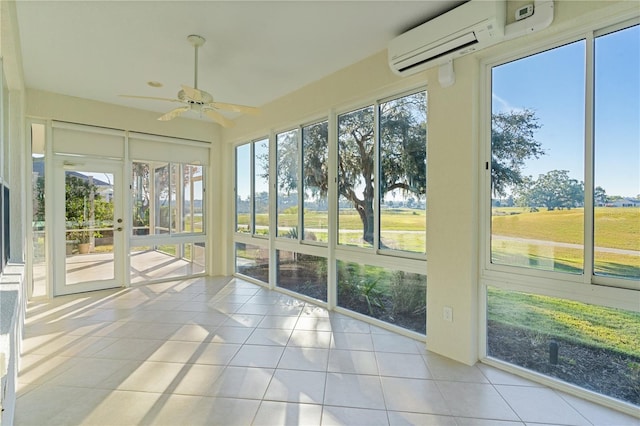 unfurnished sunroom featuring an AC wall unit and ceiling fan