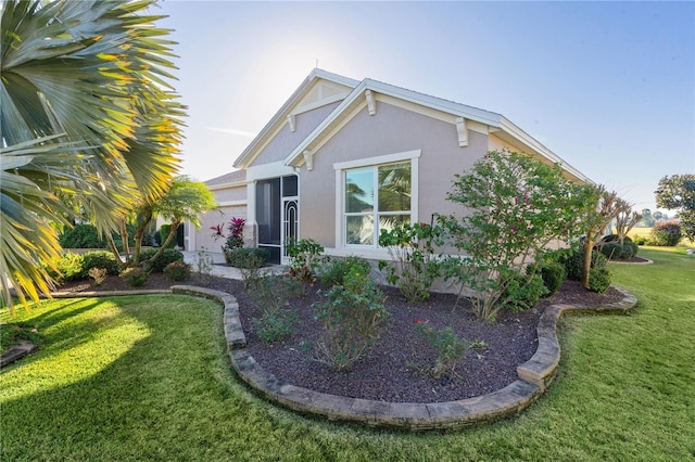 exterior space featuring a front yard and a garage