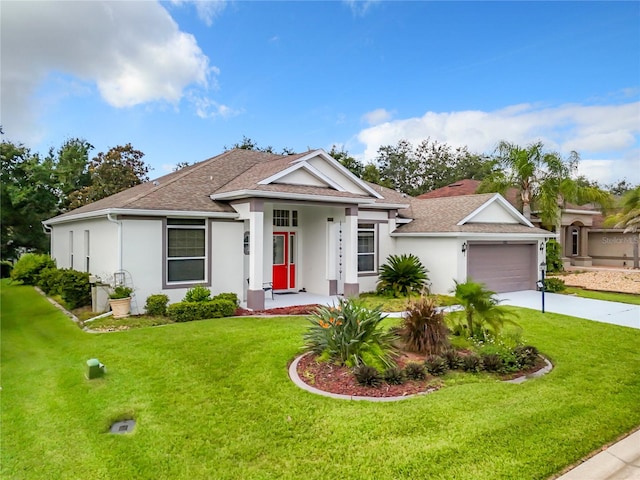 view of front of home with a garage and a front yard