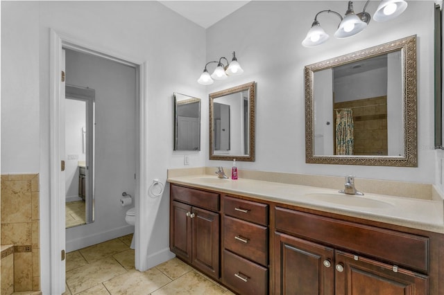 bathroom with tile patterned floors, toilet, and vanity