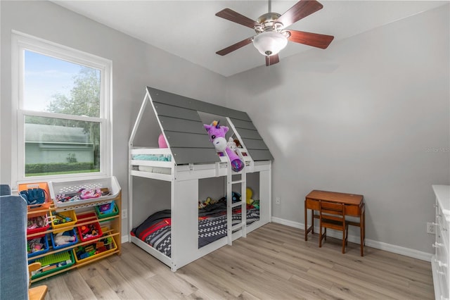 bedroom with ceiling fan and light hardwood / wood-style floors