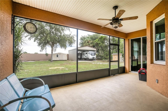 sunroom / solarium with ceiling fan