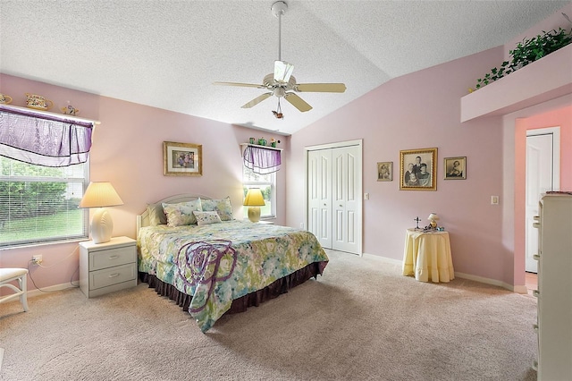 bedroom with a closet, multiple windows, vaulted ceiling, and light carpet