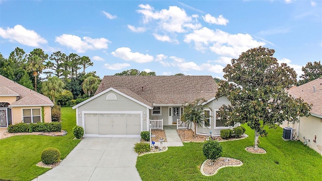 ranch-style house featuring a front yard, driveway, and an attached garage