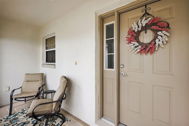 doorway to property with stucco siding