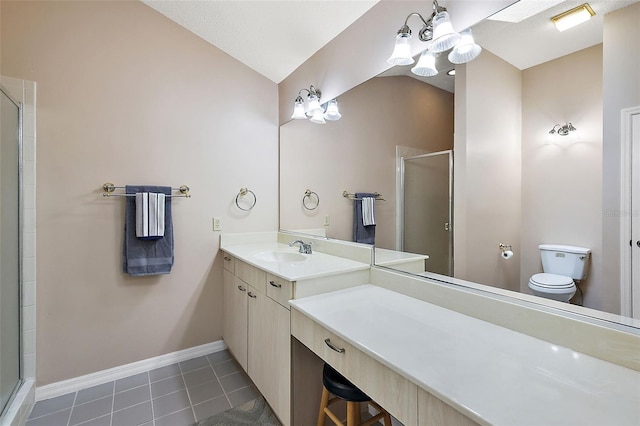 bathroom featuring toilet, vanity, tile patterned floors, walk in shower, and a notable chandelier