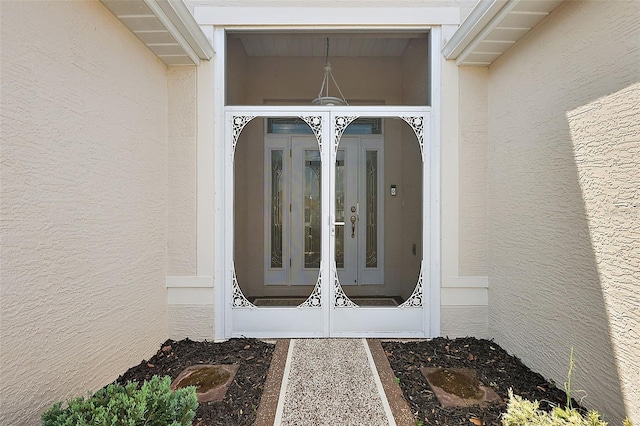 doorway to property featuring french doors