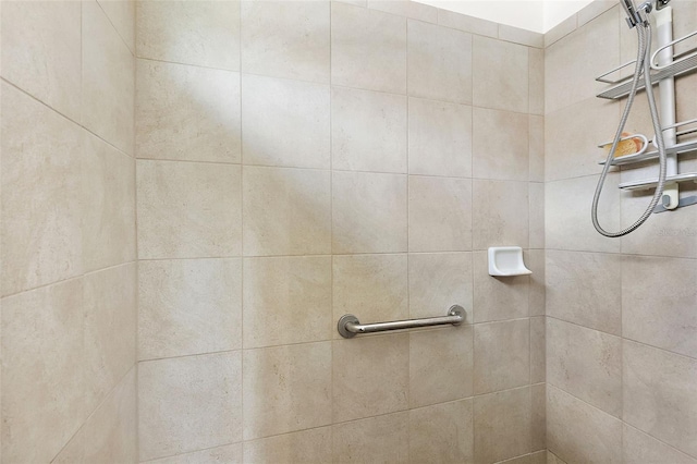 bathroom with a tile shower