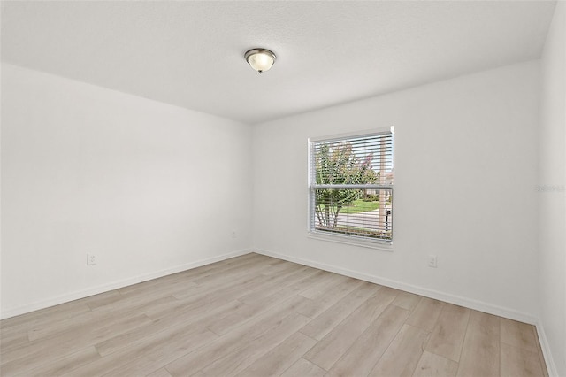 empty room with light wood-type flooring