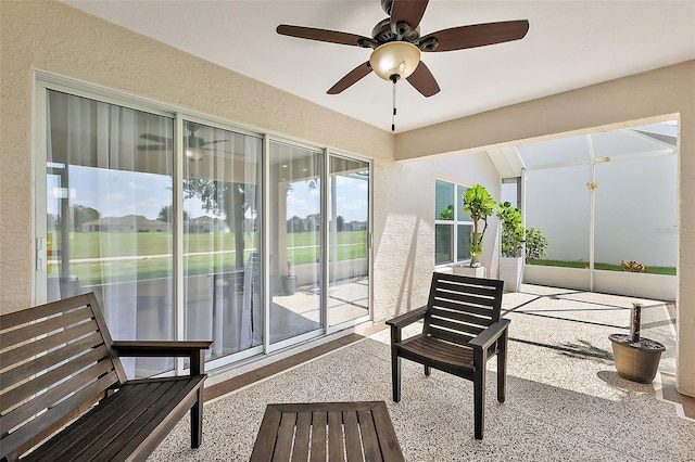 sunroom / solarium with ceiling fan