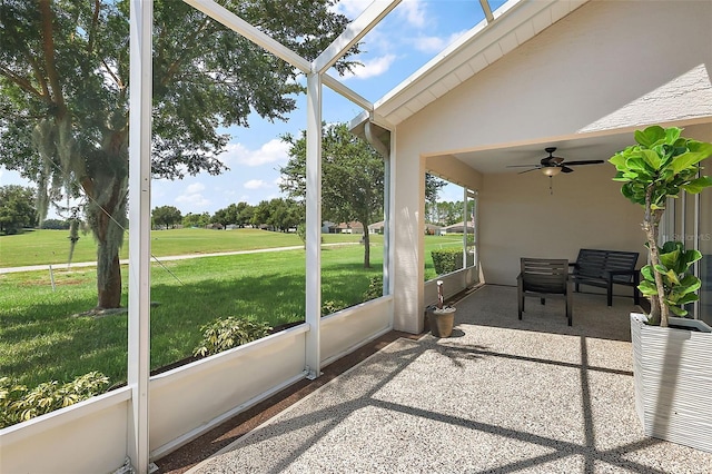 sunroom featuring ceiling fan