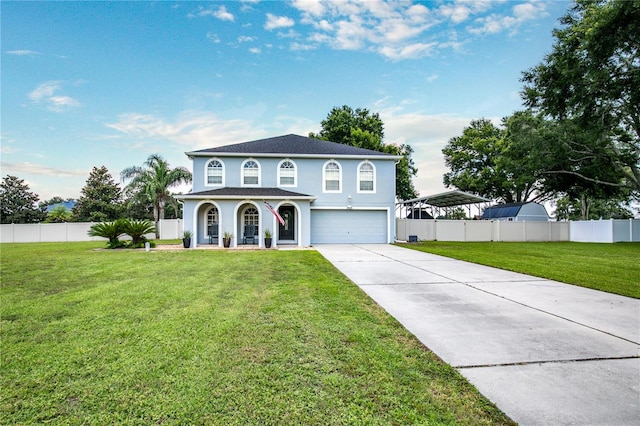 view of front of property with a garage and a front yard