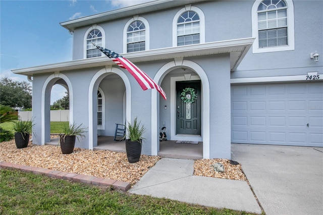 doorway to property featuring a garage